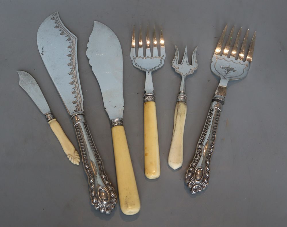 A pair of silver handled fish servers, a pair of bone handled silver fish servers and two other silver bone handled pieces